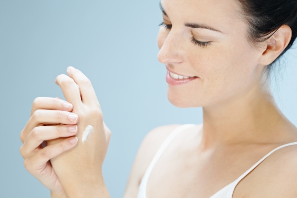 Woman applying product on her hands