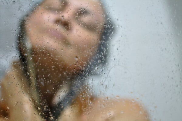 Woman washing her hair in the shower